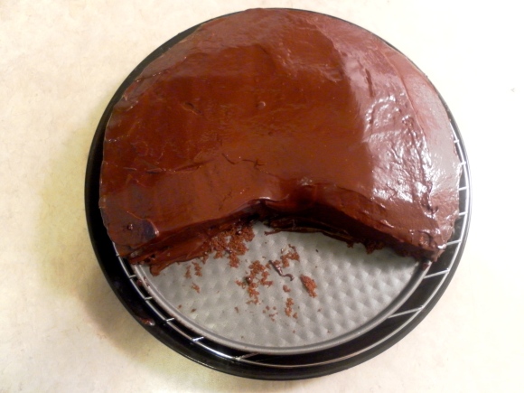 Icing a Hazelnut cake with Dark Chocolate Ganache 